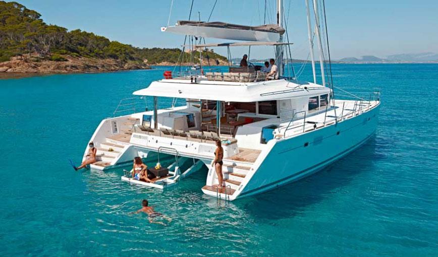 https://medshoretours.com/wp-content/uploads/2020/06/lagoon450-catamaran-santorini-sailing.jpg